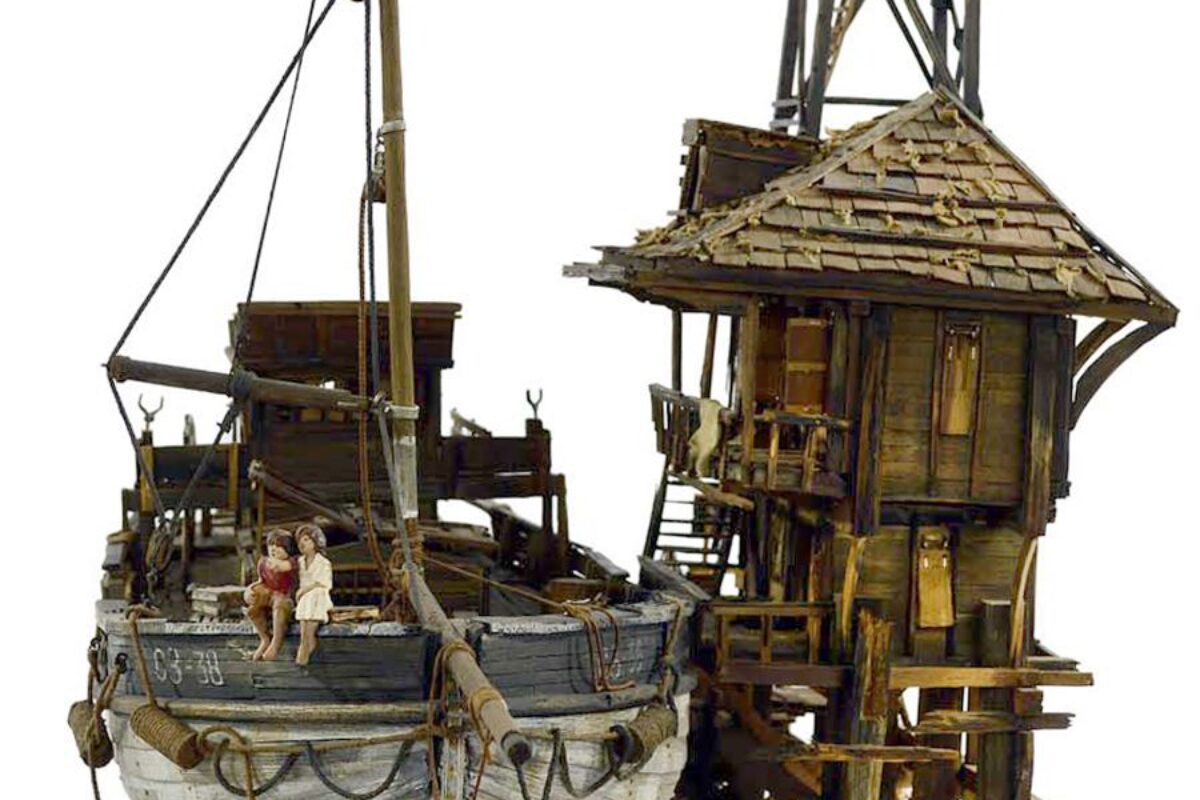 Memory_Love Story — A beautifully handcrafted sculpture of a fishing boat, featuring a boy and girl, capturing the essence of love and connection on the water.