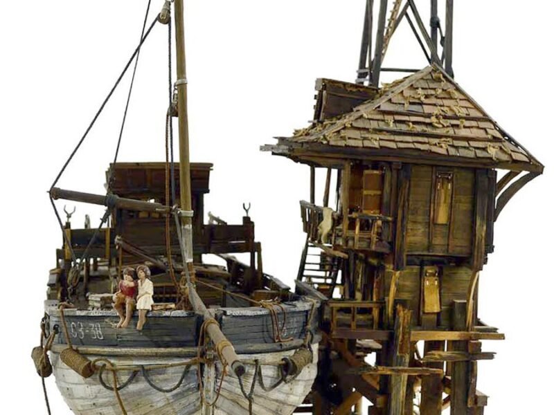 Memory_Love Story — A beautifully handcrafted sculpture of a fishing boat, featuring a boy and girl, capturing the essence of love and connection on the water.